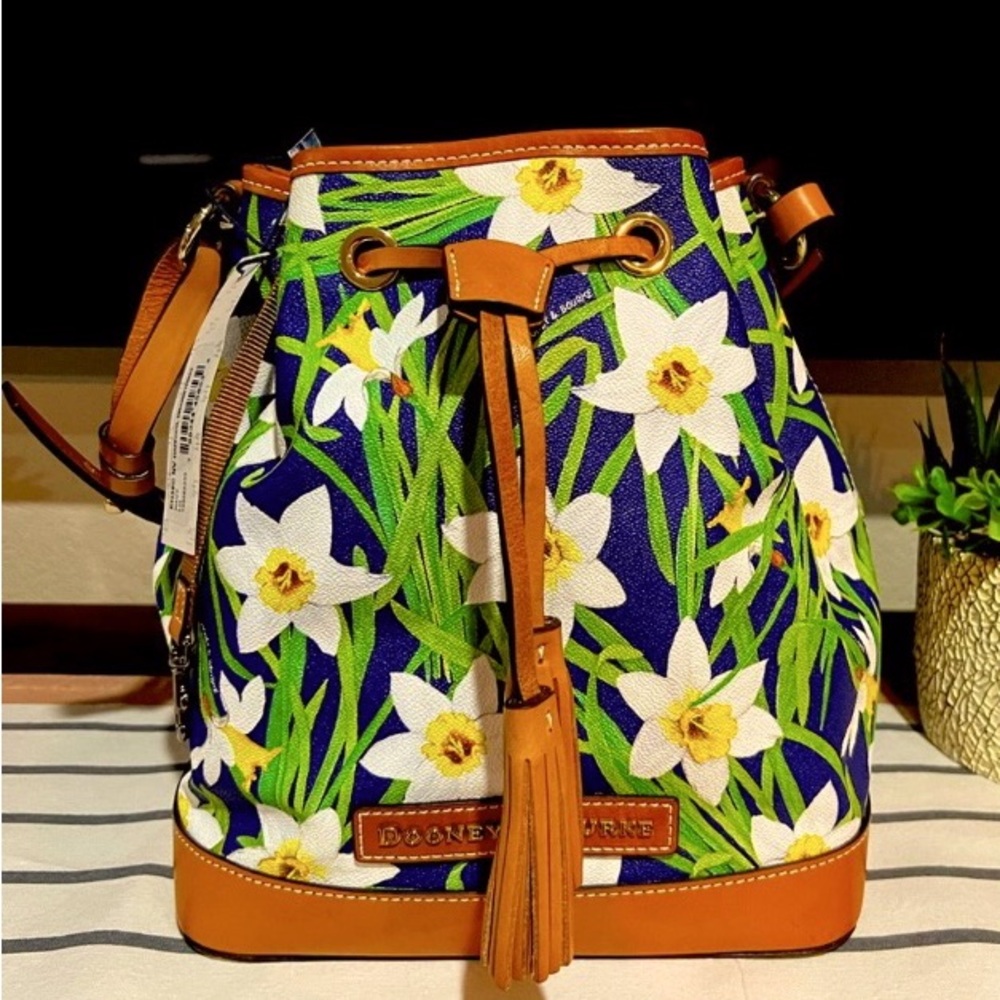 Dooney And Bourke navy blue and yellow daffodil drawstring in new condition
